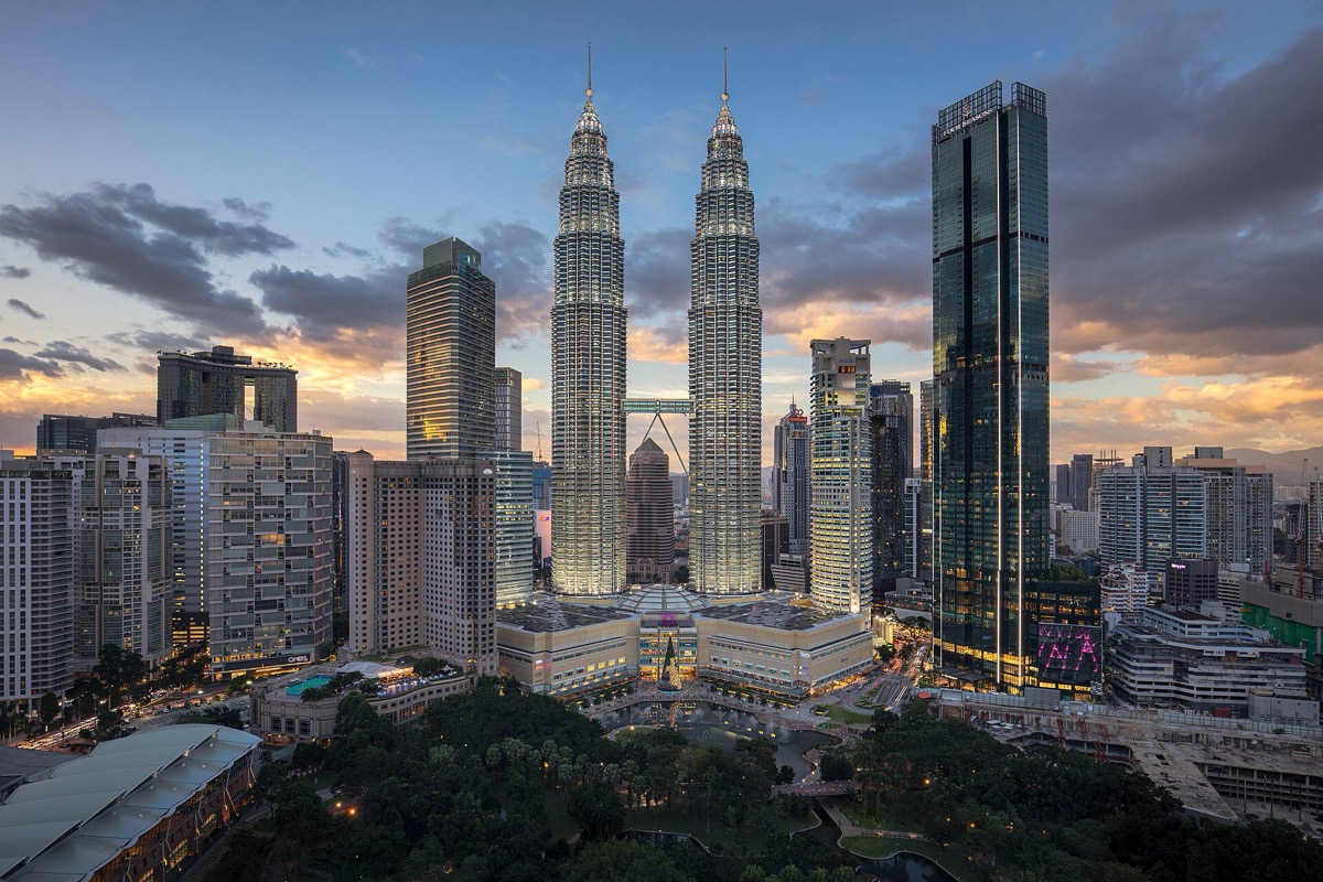 Kuala Lumpur city centre at dusk — the Petronas Towers